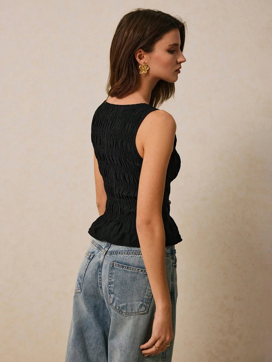 Blusa con diseño fruncido unicolor