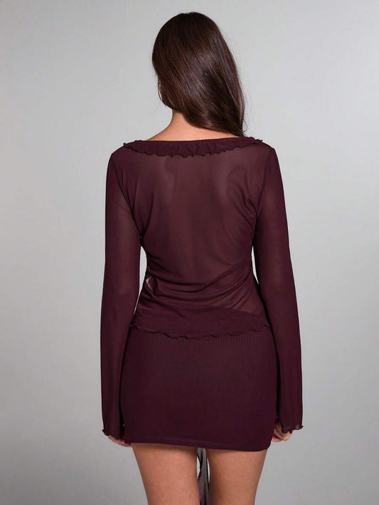 Blusa transparente con mangas acampanadas y nudo delantero