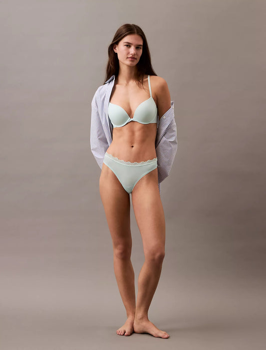 Panty elástica de microfibra unicolor con encaje y logo tipo hilo