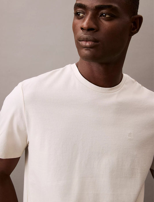 Franela a rayas cuello redondo con logo bordado