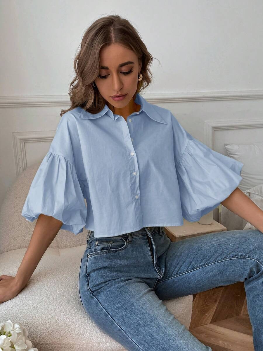 Blusa de manga acampanada