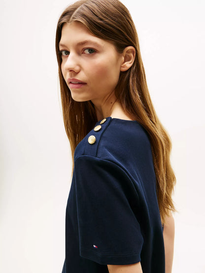 Franela cuello redondo unicolor con botones en los hombros