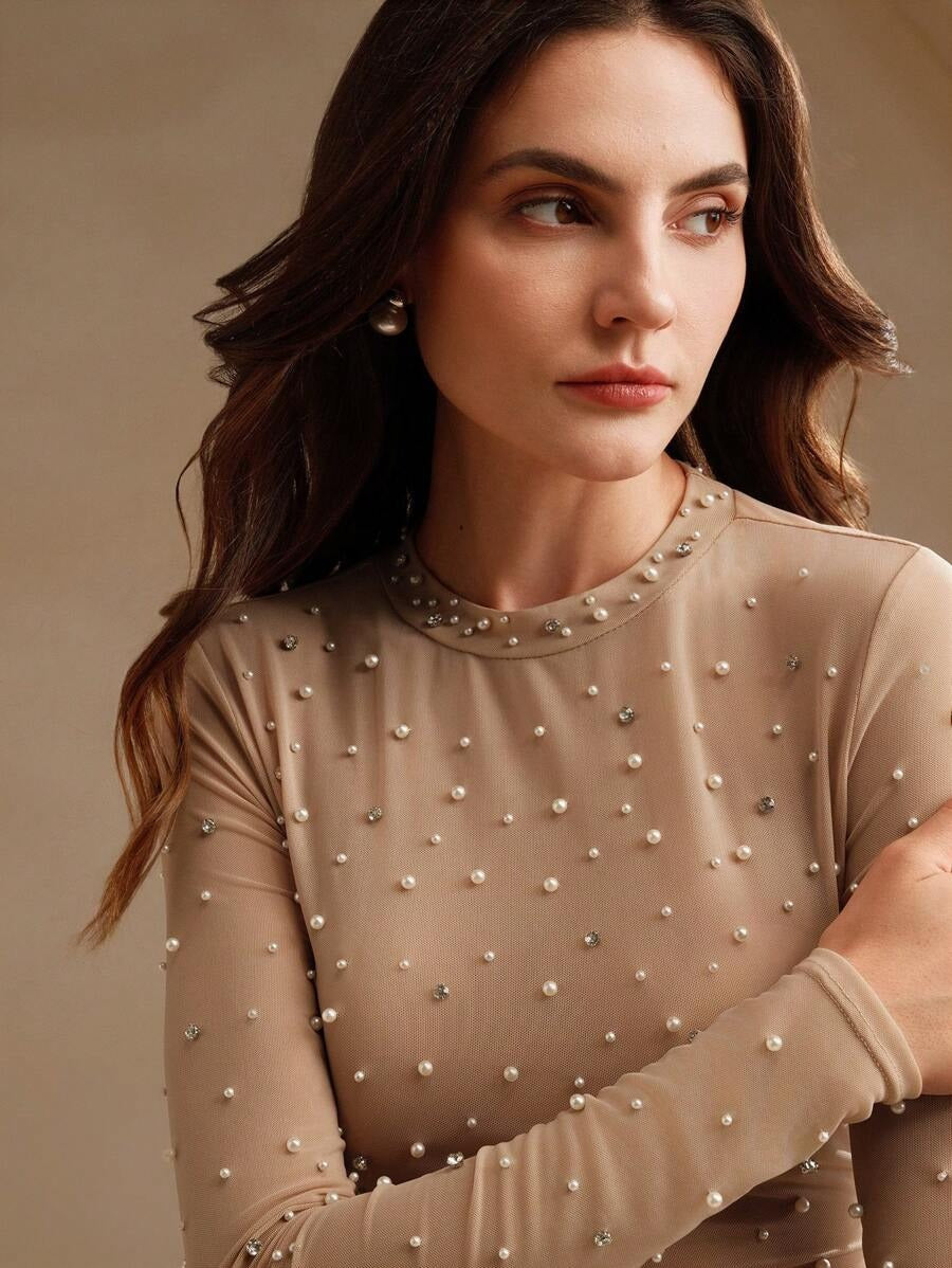 Blusa cuello alto con perlas