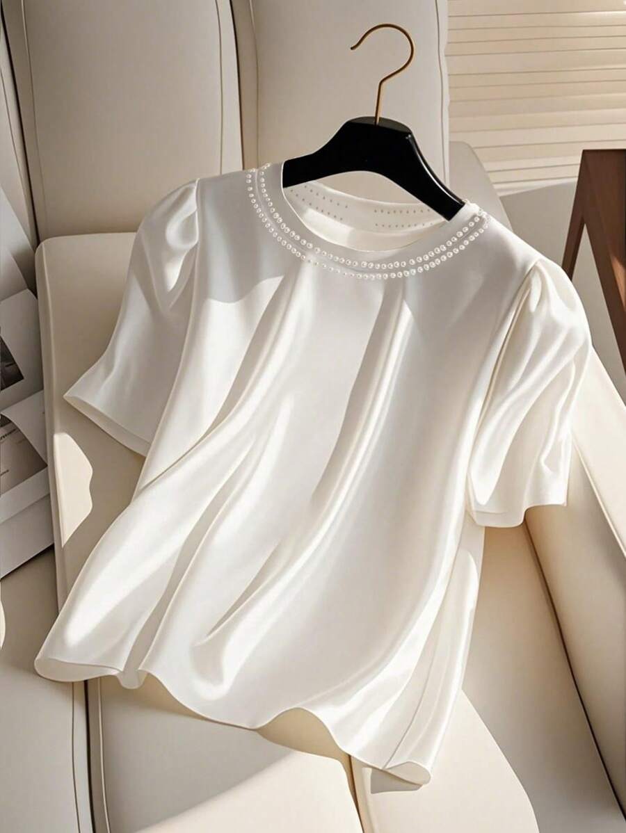 Blusa holgada de mujer  con cuello de perlas