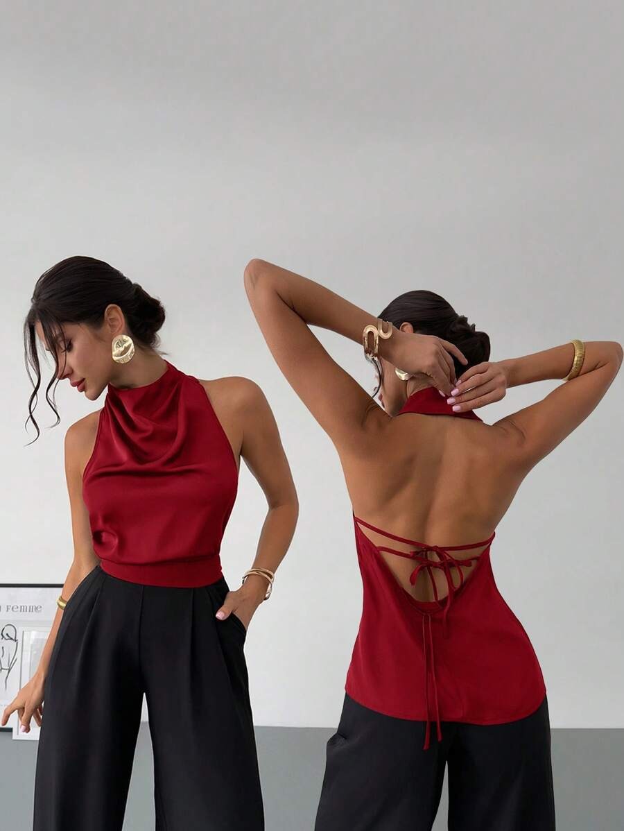 Blusa  elegante con cuello asimétrico  sin mangas, espalda descubierta y lazo