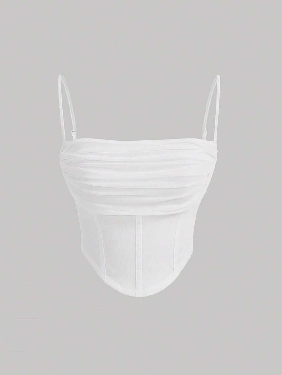 Top de dobleces sólidos y dobladillo asimétric