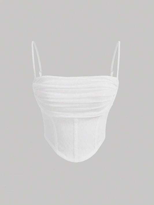 Top de dobleces sólidos y dobladillo asimétric