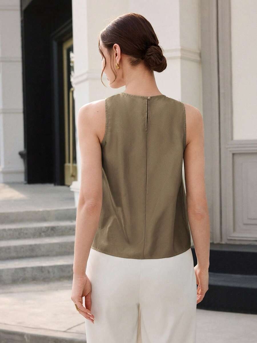 Blusa cuello redondo con pliegues y anillo