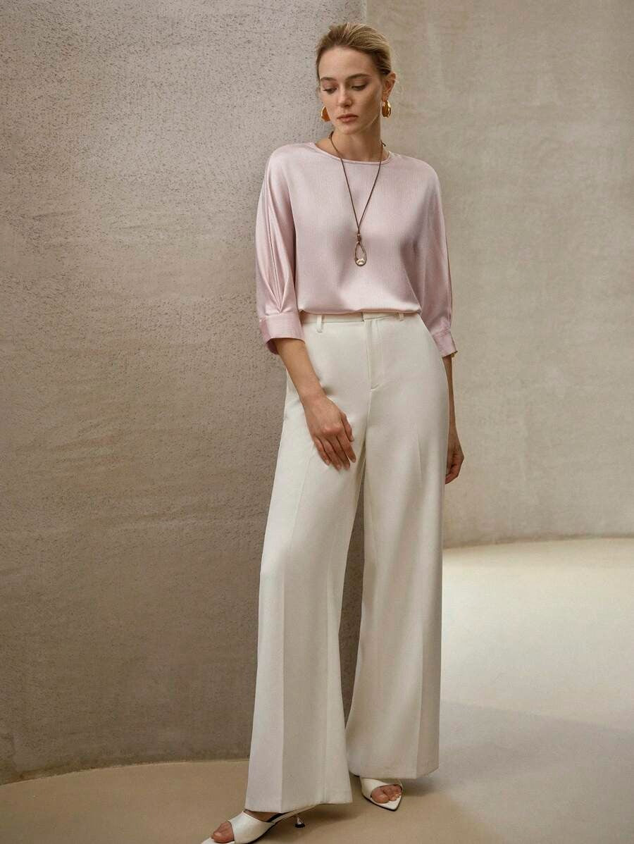 Blusa elegante de textura con orificio en la espalda