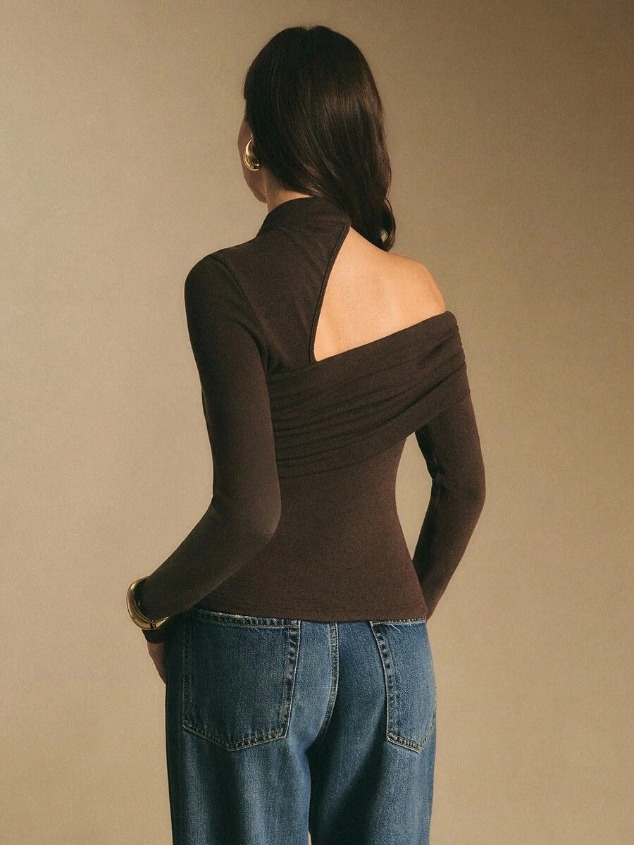 Blusa manga larga con cuello alto, recogida y abertura