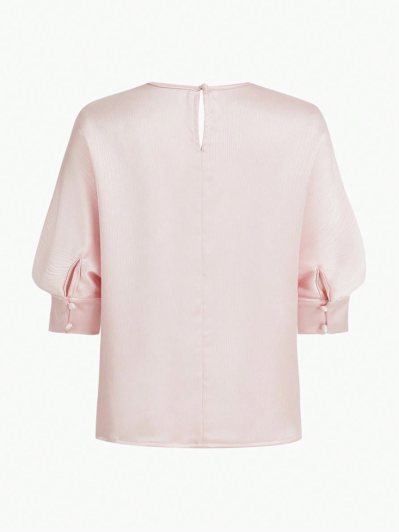 Blusa elegante de textura con orificio en la espalda