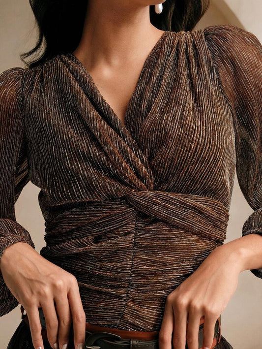 Blusa plisada espalda descubierta y con nudo central