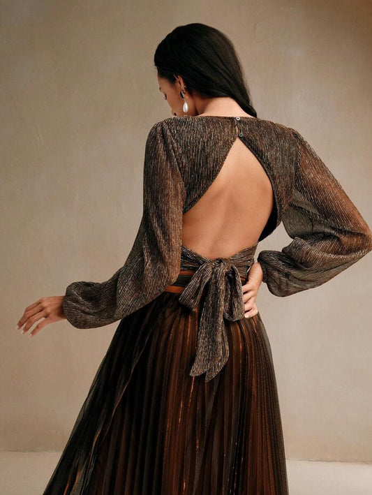 Blusa plisada espalda descubierta y con nudo central