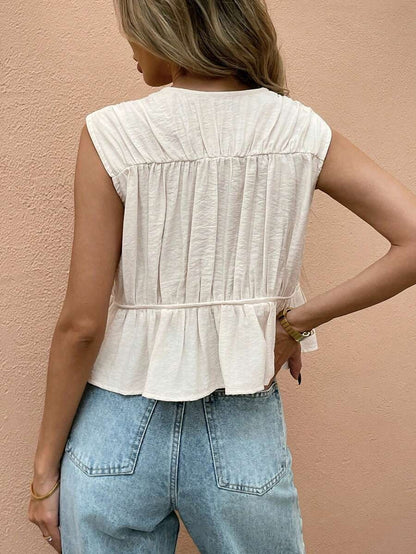 Blusa sin mangas con pliegues frontales y cordones